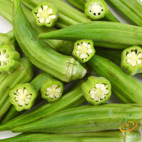 Fresh green okra pods, including sliced cross-sections, showcasing Clemson Spinless variety